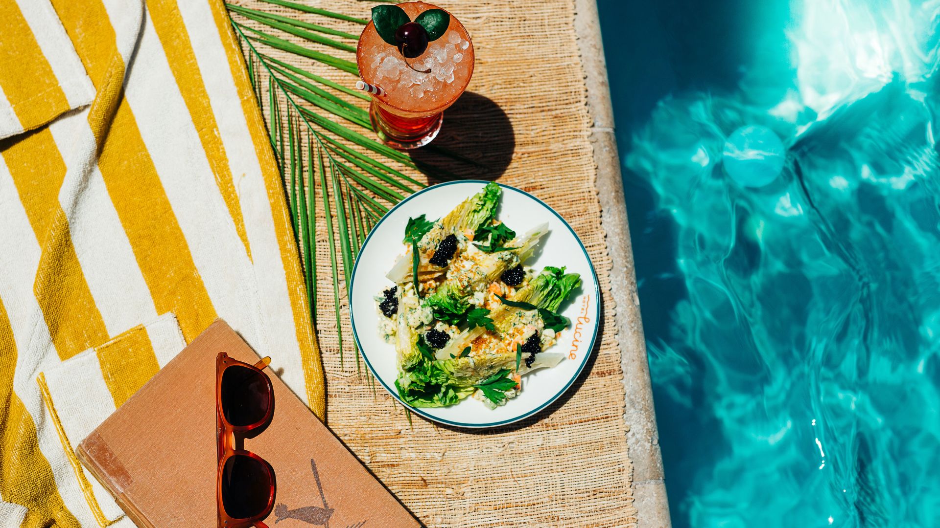 A Plate Of Food Next To A Pool